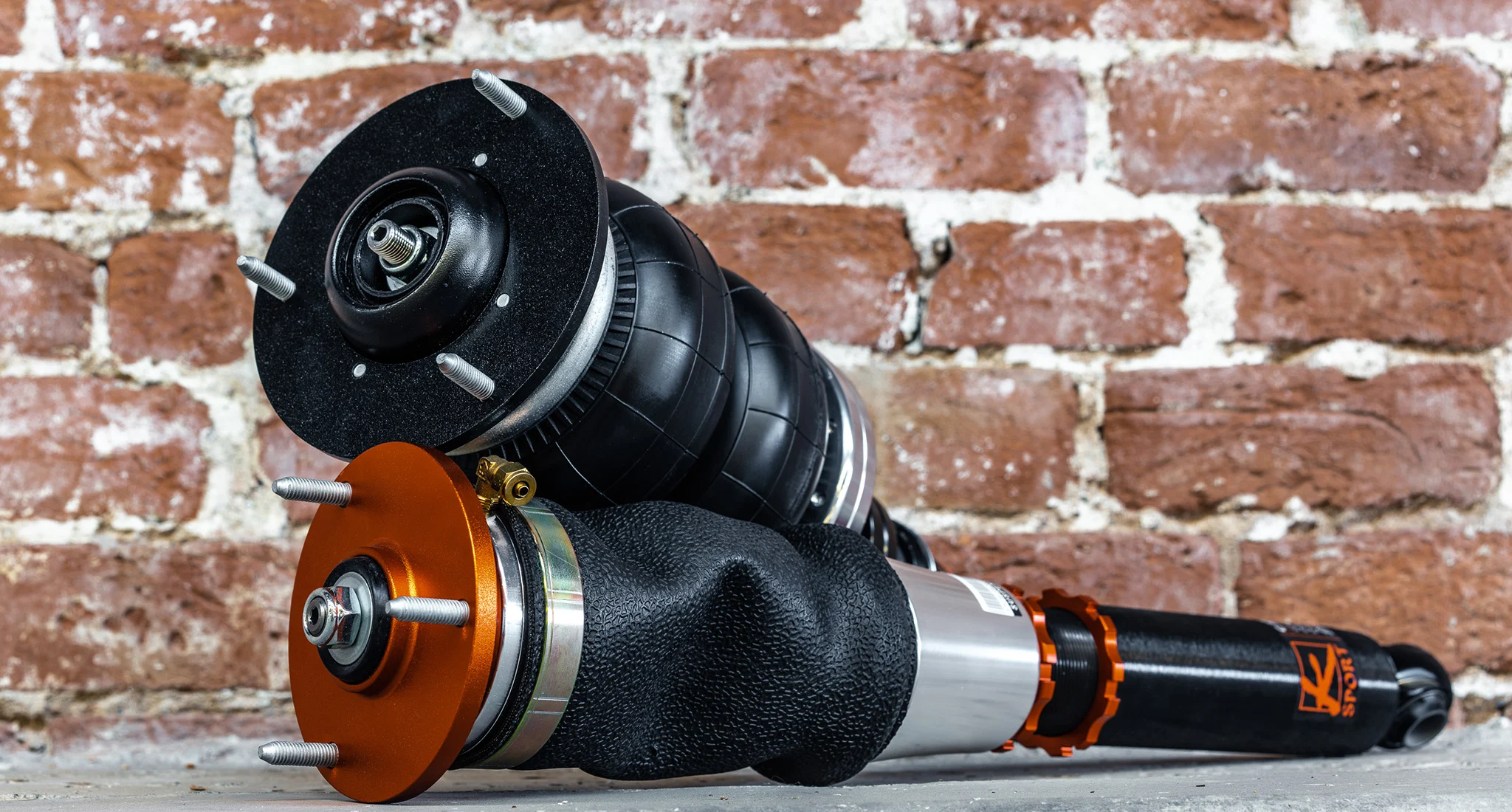 Actual KSport Airtech sleeve and double-bellow air struts against brick